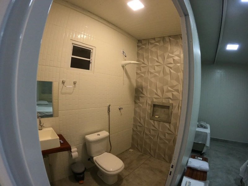 Bathroom with a shower, a toilet and a sink