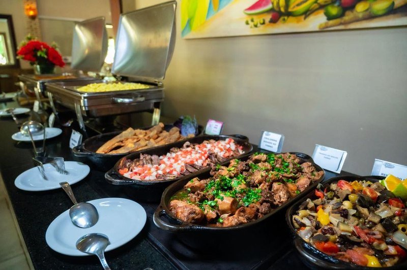 Hot dishes in dark serving pans at the lodge buffet
