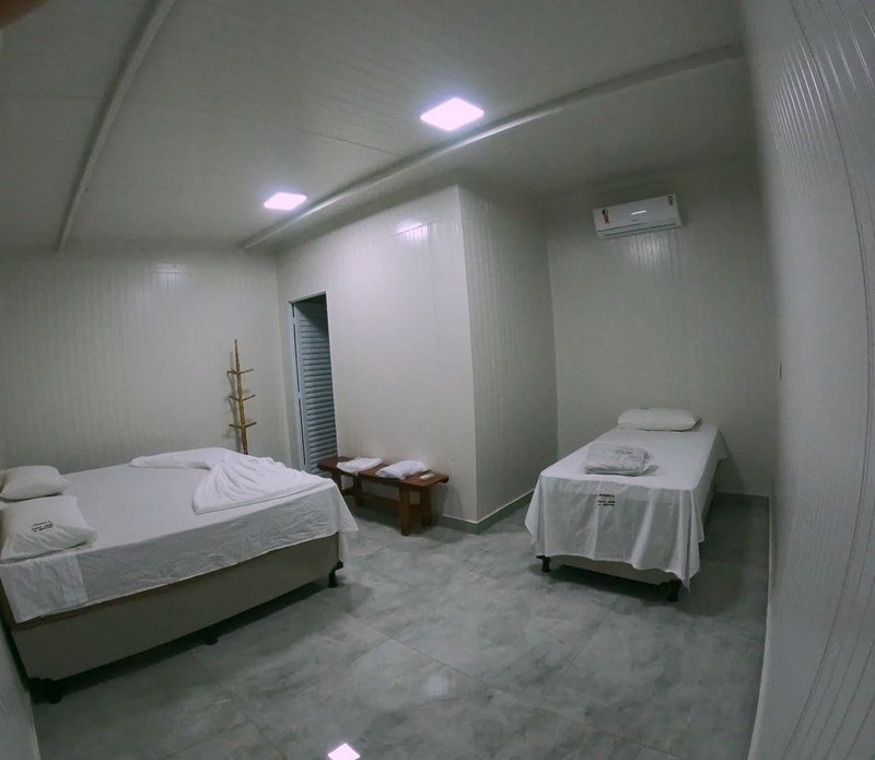 Room with a double bed and a single bed